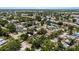 Scenic aerial view showcasing a community filled with single-Gathering homes and verdant landscaping at 8009 Somerset Ln, Tampa, FL 33615