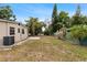 Backyard featuring a patio and grass at 8009 Somerset Ln, Tampa, FL 33615