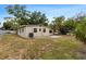 Backyard featuring a patio and grass at 8009 Somerset Ln, Tampa, FL 33615