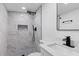 Modern bathroom with a tiled shower, and black fixtures at 8009 Somerset Ln, Tampa, FL 33615