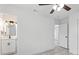 Spacious bedroom with an ensuite bathroom featuring updated white cabinets at 8009 Somerset Ln, Tampa, FL 33615