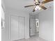Bright bedroom with a closet, ceiling fan, and view of an ensuite bathroom at 8009 Somerset Ln, Tampa, FL 33615
