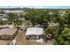 Overhead shot showing a home with mature trees, a boat, and fenced-in yard at 8009 Somerset Ln, Tampa, FL 33615