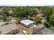 Overhead view showing home's exterior, yard, a boat, and surrounding mature trees at 8009 Somerset Ln, Tampa, FL 33615