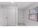 Neutral room featuring white walls and a large window at 8009 Somerset Ln, Tampa, FL 33615