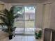 Backyard access with sliding glass doors and neutral flooring at 8313 Arabian Dunes Pl, Riverview, FL 33578