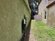 Narrow side yard with EV charger, providing convenience for electric vehicle owners at 8313 Arabian Dunes Pl, Riverview, FL 33578
