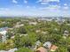 Picturesque aerial view showing the mature tree canopy, neighborhood, and the downtown skyline beyond at 848 9Th S Ave, St Petersburg, FL 33701