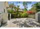 Landscaped backyard featuring a gravel parking area and well-maintained perimeter foliage at 848 9Th S Ave, St Petersburg, FL 33701