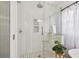 Modern glass enclosed shower and white tile for a clean, luxurious spa-like experience in this bathroom at 848 9Th S Ave, St Petersburg, FL 33701