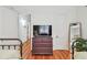 Bedroom with hardwood floors, TV on drawers and decor at 848 9Th S Ave, St Petersburg, FL 33701