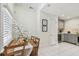 Bright dining area with natural wood table, tile floors and access to the kitchen at 848 9Th S Ave, St Petersburg, FL 33701