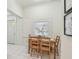 Cozy dining area featuring a wooden table, chairs, and a window with blinds at 848 9Th S Ave, St Petersburg, FL 33701