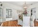 Dining area with hardwood floors, view into the kitchen, and decorative lighting at 848 9Th S Ave, St Petersburg, FL 33701
