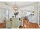 Dining room with decorative light, hardwood floors, and an open doorway to the living area at 848 9Th S Ave, St Petersburg, FL 33701