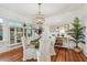 Dining room featuring a decorative light fixture, large windows, and hardwood floors at 848 9Th S Ave, St Petersburg, FL 33701