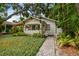 Charming bungalow featuring mature landscaping, covered front porch, and inviting curb appeal at 848 9Th S Ave, St Petersburg, FL 33701