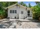 Charming home featuring light siding, black trim, and brick-paver sidewalk at 848 9Th S Ave, St Petersburg, FL 33701