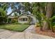 Charming bungalow featuring mature landscaping, covered front porch, and inviting curb appeal at 848 9Th S Ave, St Petersburg, FL 33701