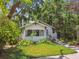 Charming home featuring a covered front porch and lush landscaping in the front yard at 848 9Th S Ave, St Petersburg, FL 33701