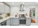 Well-equipped kitchen featuring stainless steel appliances, and elegant gray cabinets at 848 9Th S Ave, St Petersburg, FL 33701