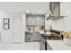 Well-equipped kitchen featuring stainless steel appliances, and elegant gray cabinets at 848 9Th S Ave, St Petersburg, FL 33701