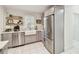 Kitchen with stainless steel appliances, quartz countertops, a farmhouse sink, and gray cabinets at 848 9Th S Ave, St Petersburg, FL 33701