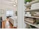 Bright bedroom showcasing a well-organized linen closet with woven baskets, plants, and soft, white towels at 848 9Th S Ave, St Petersburg, FL 33701