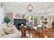 Comfortable living area featuring a fireplace, hardwood floors, and lots of windows for natural light at 848 9Th S Ave, St Petersburg, FL 33701