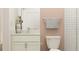 This bathroom features a stylish vanity with granite countertop and a shower with tiled walls at 9414 Gladsome Dr, Land O Lakes, FL 34637