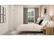 Serene bedroom with a cozy bed, bedside tables with lamps, and a decorative wall art piece at 9414 Gladsome Dr, Land O Lakes, FL 34637