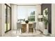 Well-lit dining room showcases a round table and comfortable seating by a large window at 9414 Gladsome Dr, Land O Lakes, FL 34637