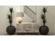 Entryway with a stylish console table, decorative lamps, and modern plant pots at 9414 Gladsome Dr, Land O Lakes, FL 34637