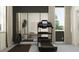 Bright home gym with large mirror, providing an open, airy space for exercise at 9414 Gladsome Dr, Land O Lakes, FL 34637