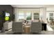 Cozy living room featuring comfortable seating, modern decor, and natural light at 9414 Gladsome Dr, Land O Lakes, FL 34637