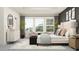 Bright main bedroom with plenty of natural light with accent furniture, decor and artwork at 9414 Gladsome Dr, Land O Lakes, FL 34637