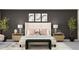 Well-lit primary bedroom features decor lighting, neutral colors, artwork and en-suite bathroom at 9414 Gladsome Dr, Land O Lakes, FL 34637