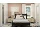 Stylish main bedroom showcasing a comfortable bed, bedside tables, and walk-in closets at 9414 Gladsome Dr, Land O Lakes, FL 34637