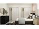 Comfortable bedroom featuring a bed, dresser, and closet space for storage at 9414 Gladsome Dr, Land O Lakes, FL 34637