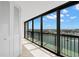 Balcony with tiled flooring offering sweeping waterfront views at 9425 Blind Pass Rd # 1008, St Pete Beach, FL 33706
