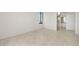 Neutral bedroom with light tile flooring, closet with mirror doors, and views of the water at 9425 Blind Pass Rd # 1008, St Pete Beach, FL 33706