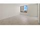 Bedroom with tiled floor, natural light, and neutral color palette at 9425 Blind Pass Rd # 1008, St Pete Beach, FL 33706