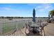 Waterfront community deck with tables, chairs, and beautiful ocean views at 9425 Blind Pass Rd # 1008, St Pete Beach, FL 33706