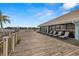 Community deck with several lounge chairs and beautiful water views at 9425 Blind Pass Rd # 1008, St Pete Beach, FL 33706