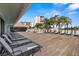 Community deck with several lounge chairs and beautiful water views at 9425 Blind Pass Rd # 1008, St Pete Beach, FL 33706
