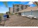 Community deck with picnic tables, grills, and beautiful water views at 9425 Blind Pass Rd # 1008, St Pete Beach, FL 33706