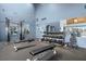 Well-equipped gym with machines, free weights, and a mirrored wall to enhance workouts at 9425 Blind Pass Rd # 1008, St Pete Beach, FL 33706
