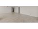 Bright living room featuring tile floors and neutral walls at 9425 Blind Pass Rd # 1008, St Pete Beach, FL 33706