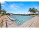 Inviting community pool with clear blue water, surrounded by lush landscaping and plenty of lounge space at 9425 Blind Pass Rd # 1008, St Pete Beach, FL 33706