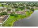 Lush landscaped aerial view of a waterfront community, showcasing serene lake views at 1012 Radison Lake Ct # 59, Sun City Center, FL 33573